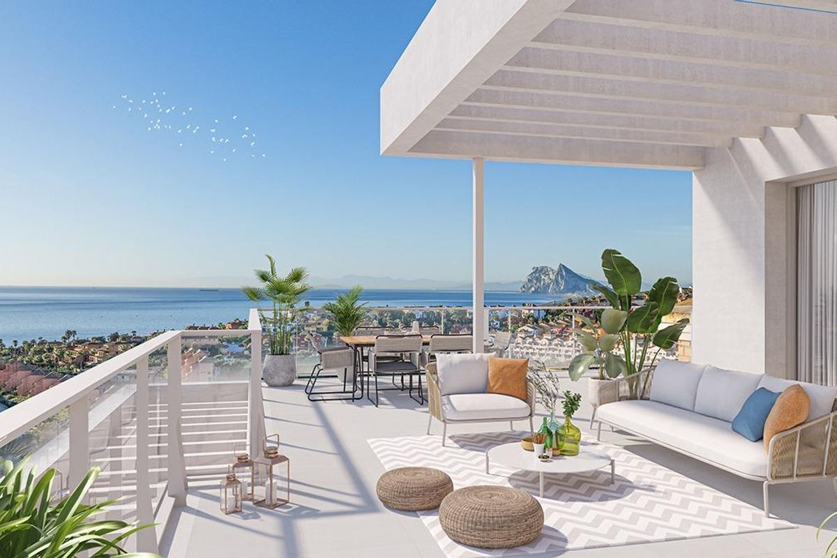 Spacious penthouse terrace with modern furniture overlooking the sea in San Roque, Costa del Sol.