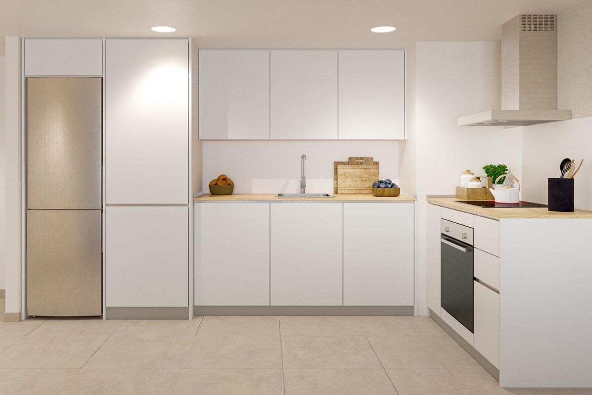 Modern, strak keukenontwerp met apparatuur en open indeling in een appartement in Mijas.