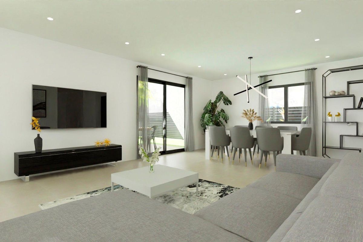 Spacious living area of a 3-bed villa with a dining space and modern furniture, located in Monforte del Cid.