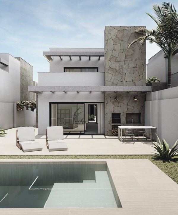 Buitenzicht op een moderne villa met 3 slaapkamers in San Juan de los Terreros, met zwembad en loungeruimte.