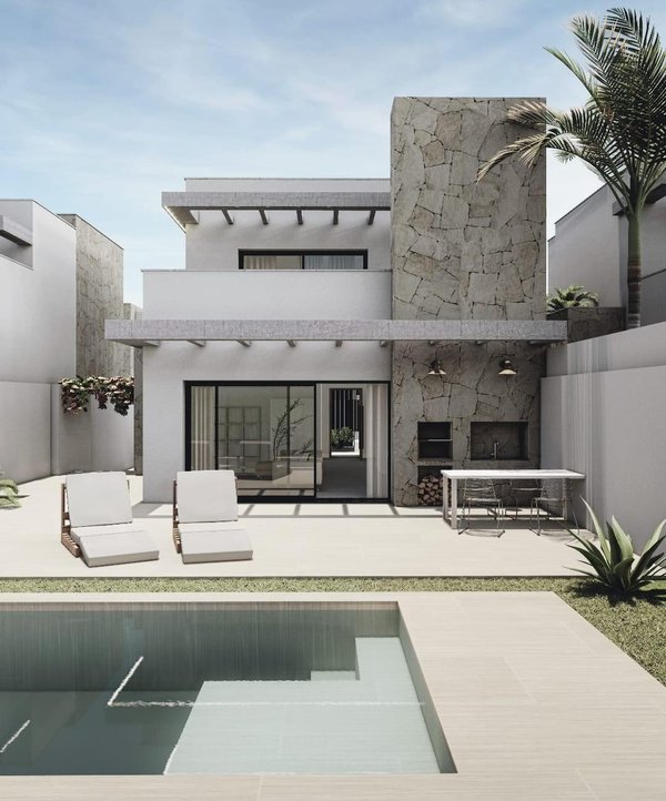 Buitenzicht op een moderne villa met 3 slaapkamers in San Juan de los Terreros, met zwembad en loungeruimte.