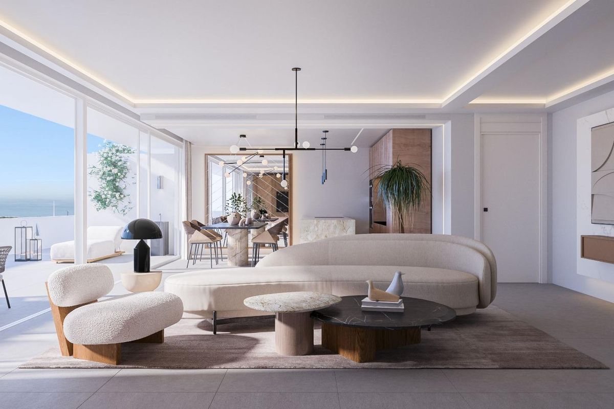 Heldere moderne woonkamer in een appartement op de begane grond, met uitzicht op het terras in Fuengirola.