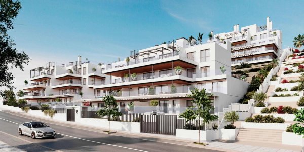 Buitenzicht op een 3-slaapkamer penthouse in Estepona, met moderne architectuur en omringend groen.