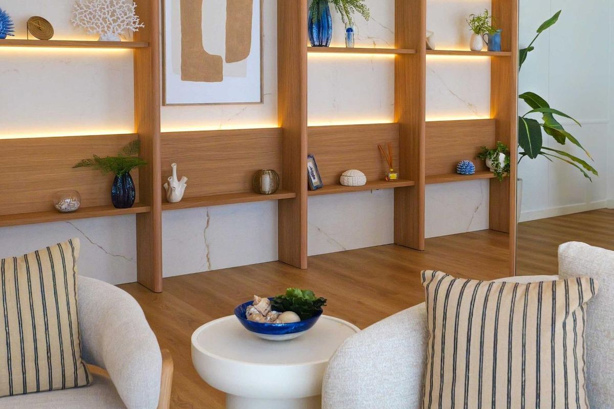 Stylish living space with decorative shelves and cozy seating, capturing the essence of La Manga living.