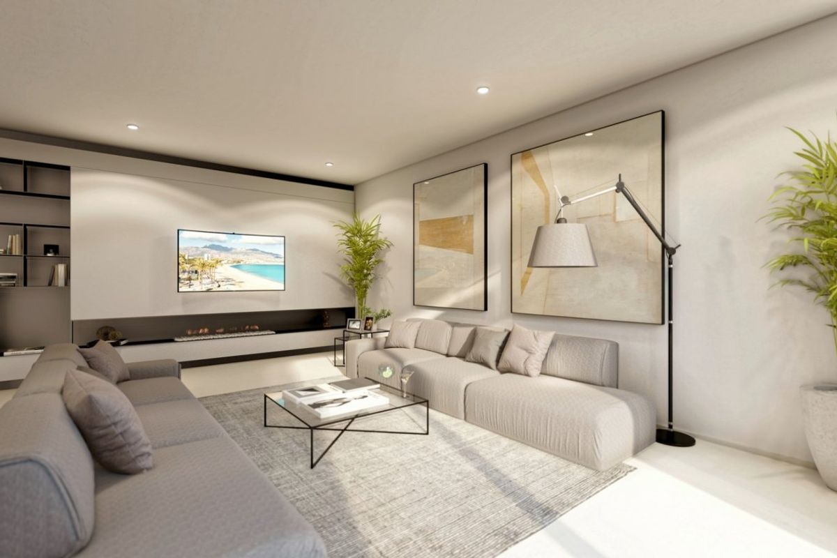 Gezellige moderne woonkamer in een 4-slaapkamer villa met stijlvolle inrichting en grote ramen, gelegen in Altea, Costa Blanca Noord.