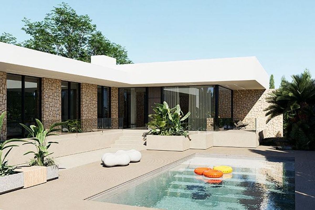 Uitzicht op het zwembadgebied in een moderne villa gelegen in Torrevieja, Costa Blanca Zuid, omringd door groen.