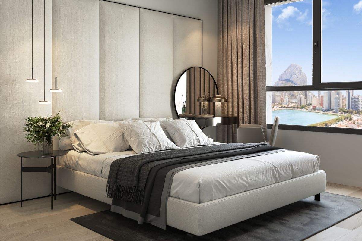 Elegant slaapkamer in een appartement in Calpe, met moderne meubels en een prachtig uitzicht naar buiten.