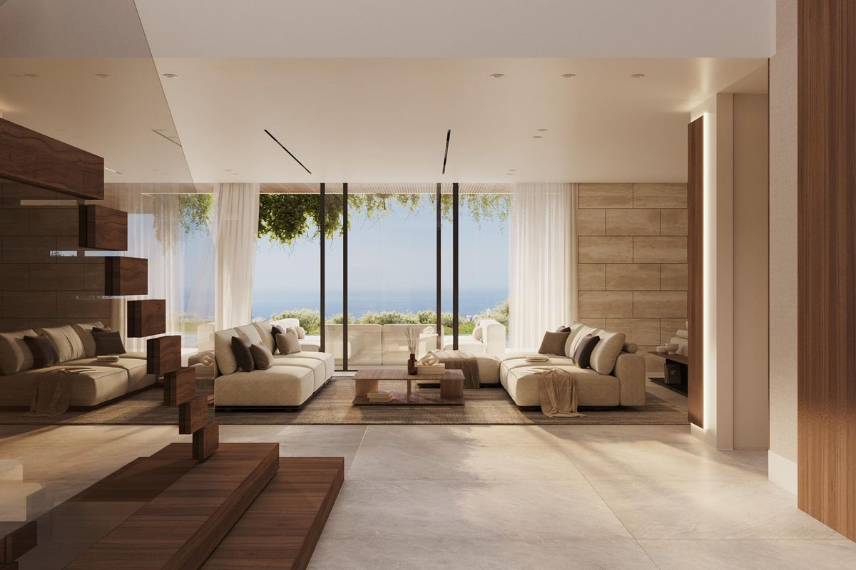 Moderne woonkamer met uitgestrekt uitzicht vanuit een villa in Benahavís, die een combinatie van comfort en stijl laat zien.