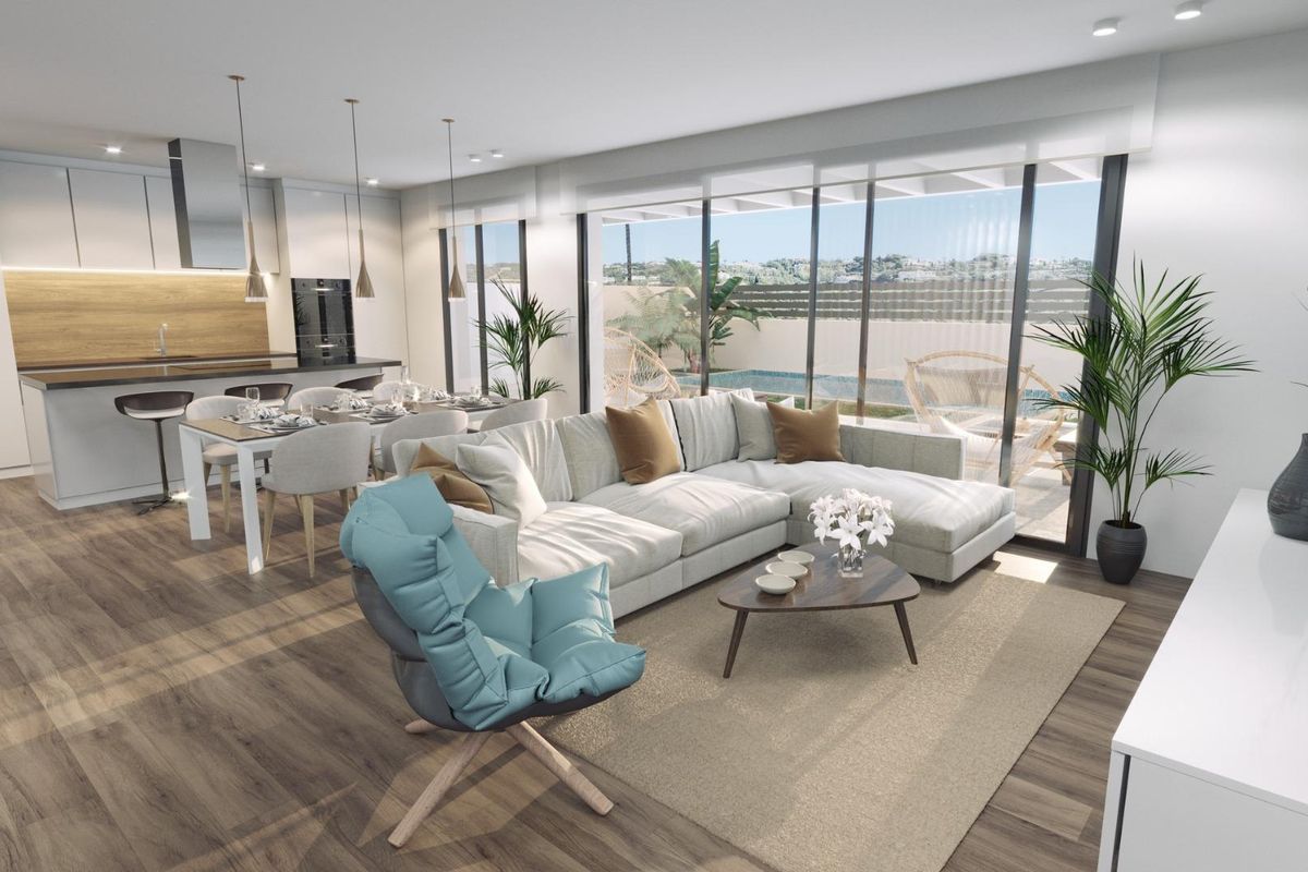 Heldere woonkamer van een 3-slaapkamer villa in Finestrat, met moderne meubels en uitzicht op het zwembad.