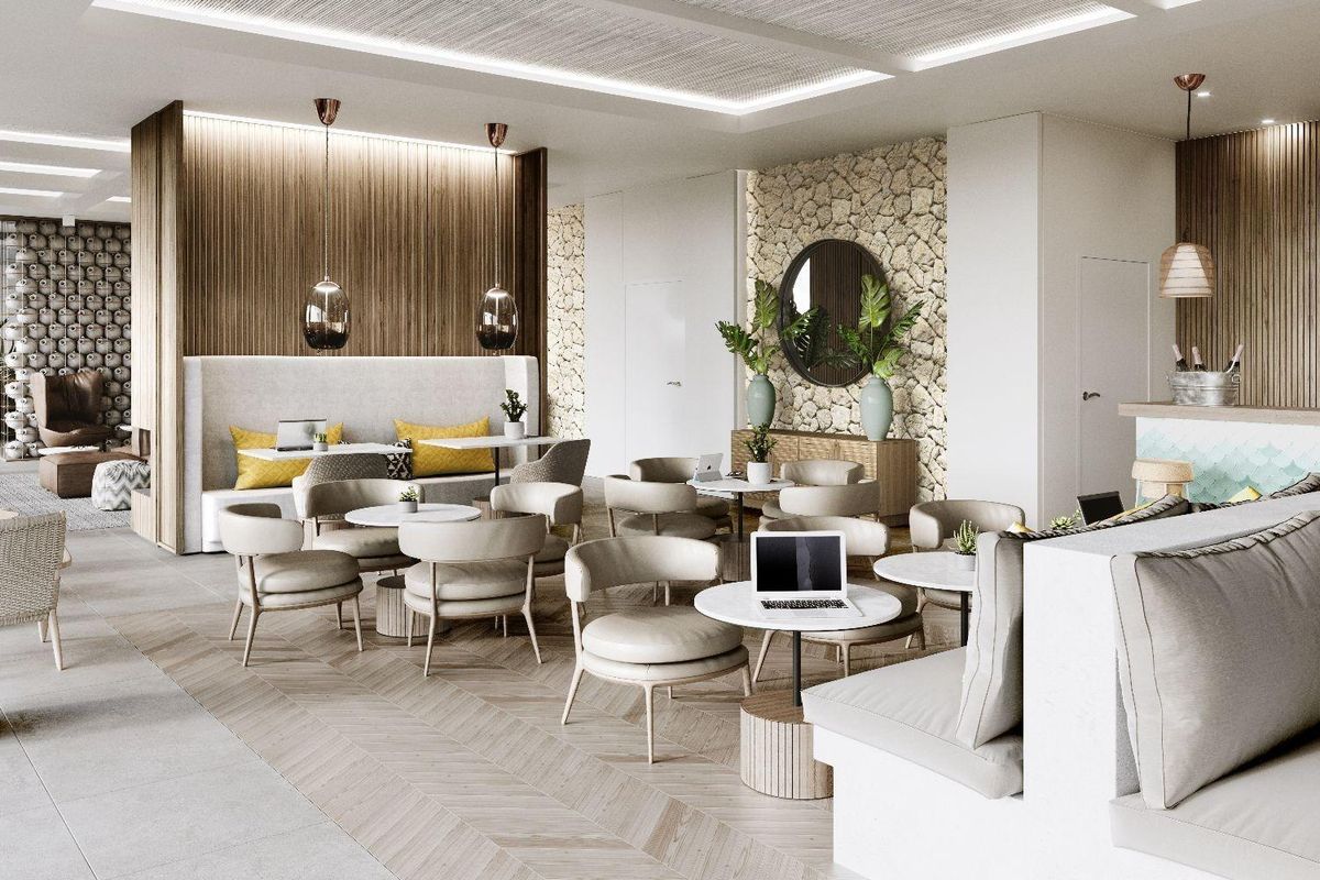 Stijlvolle gemeenschappelijke ruimte met zitplaatsen en groen, ontworpen voor ontspanning in de moderne appartementengemeenschap van Estepona.