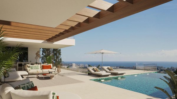 Luxe terras met zwembad en uitzicht op de oceaan bij de 4-slaapkamer villa in Estepona, Costa del Sol.