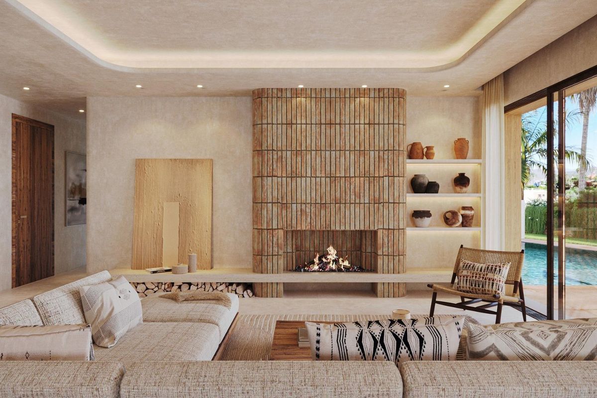 Stijlvolle woonkamer met rustieke decoratie in een 3-slaapkamer villa in Jávea, met een moderne open haard.