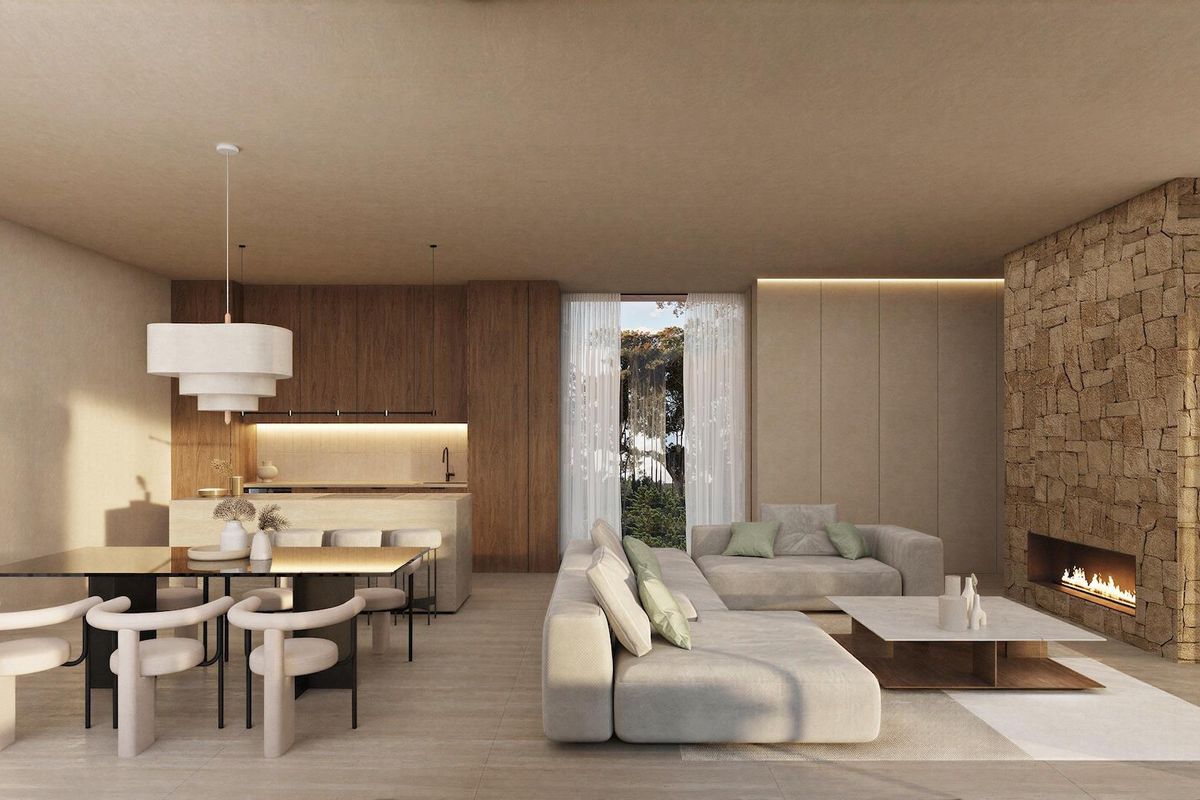 Stijlvolle woonkamerinterieur van de 4-slaapkamer villa met een gezellige open haard en eetruimte.