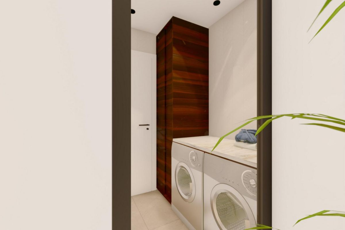 Uitzicht op de functionele waskamer met apparaten in een villa in Benijofar, die minimalistisch ontwerp toont.