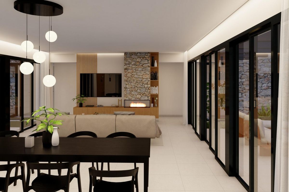 Ruime woonkamer met moderne meubels en grote ramen die naar het terras leiden in een villa in Yecla.