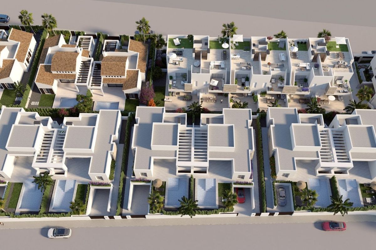 Luchtfoto van townhouses en appartementen, die de indeling van de gemeenschap in Algorfa, Costa Blanca Zuid, toont.