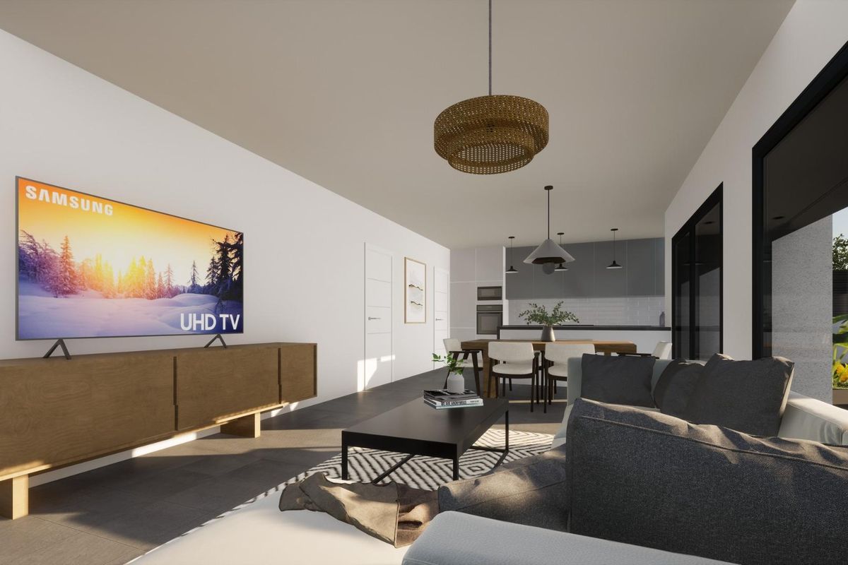 Bright and airy living room in the Pinoso villa, complete with a large TV and stylish furnishings.