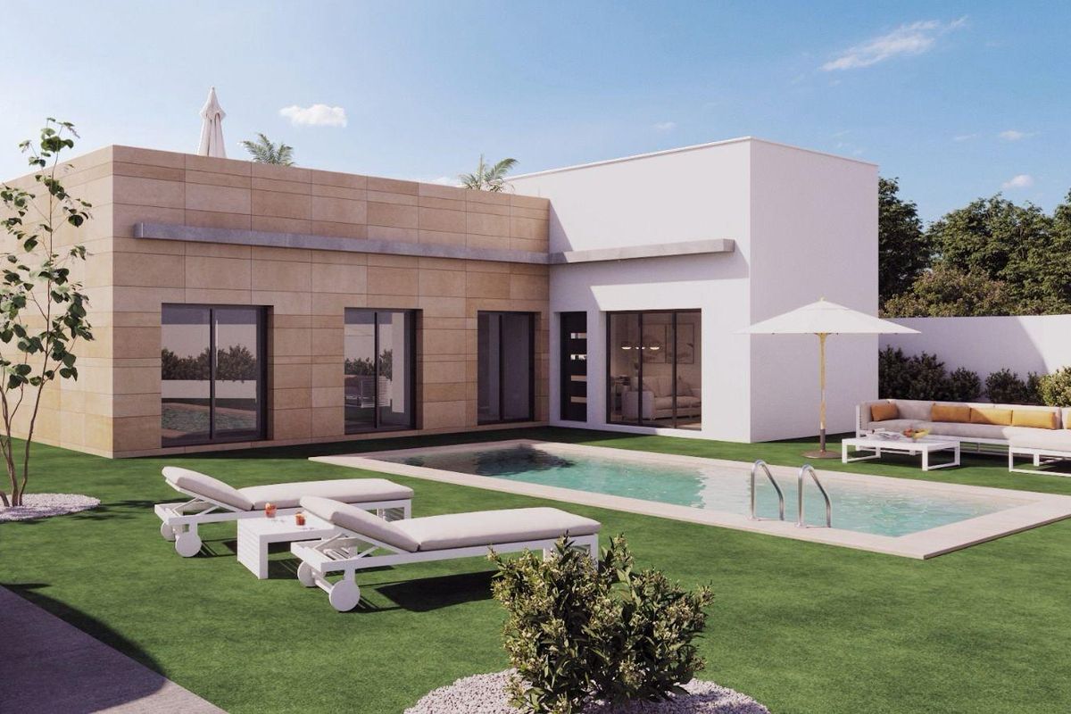 Exterior of a modern 3-bed villa in Mazarron, Spain. Features include a private pool, lawn, patio furniture, and minimalist design.