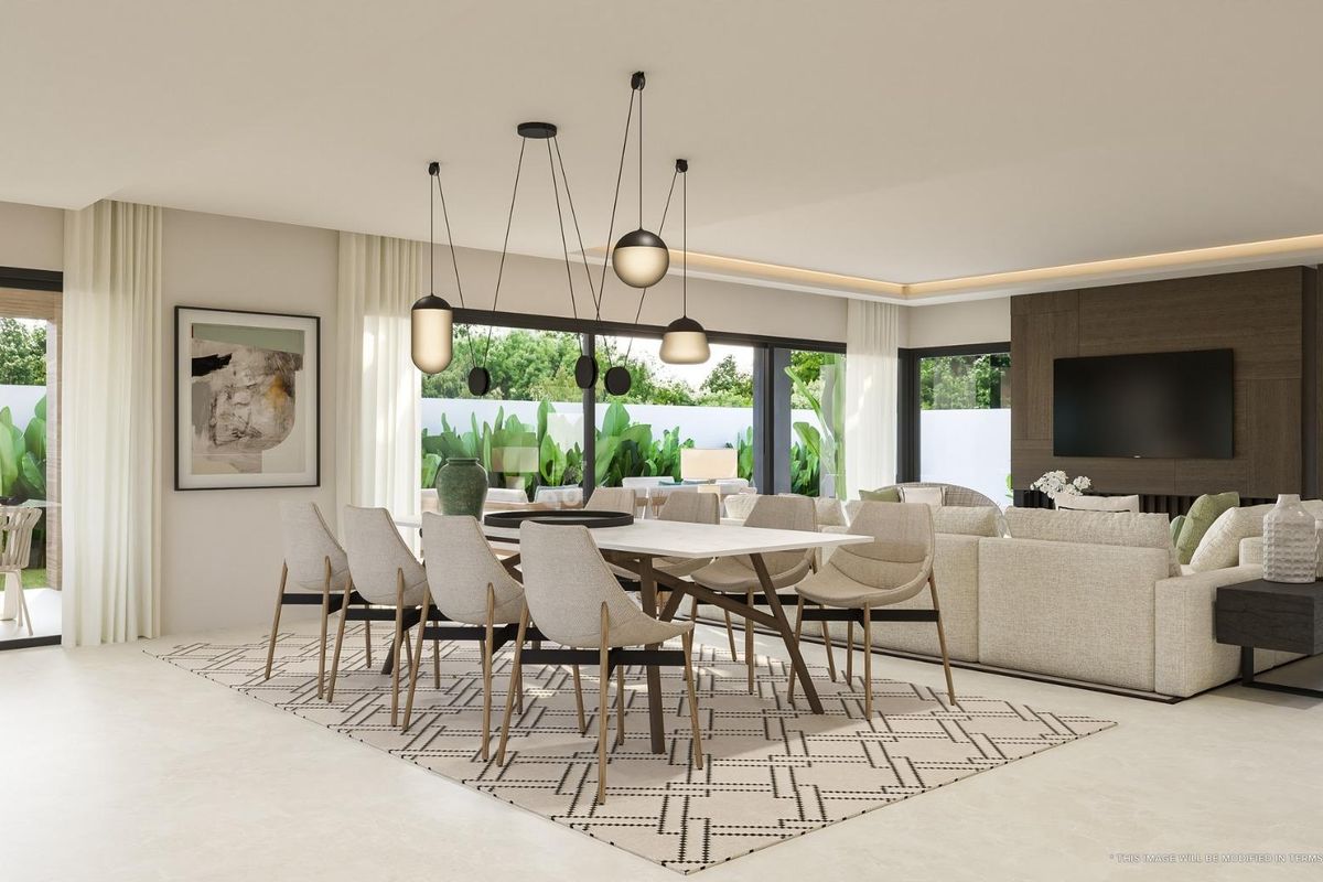 Heldere eetruimte met moderne decoratie en grote ramen die uitzicht bieden op de buitenlucht in villa in Mijas.