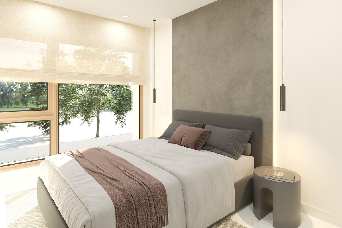 Interior of a bedroom in Dolores 3-bed townhouse, featuring a large window and modern design elements, Costa Blanca South.