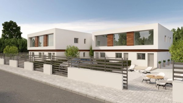 Buitenzicht op een moderne 2-slaapkamer town house in Orihuela Costa, met een stijlvol ontwerp en groen.