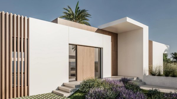 Modern exterior of a 3-bedroom townhouse in El Campello, Costa Blanca, featuring greenery and stylish design.