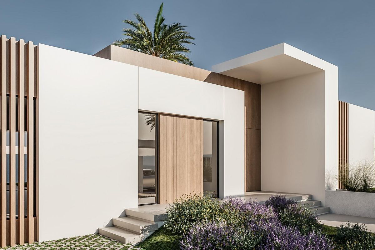 Modern exterior of a 3-bedroom townhouse in El Campello, Costa Blanca, featuring greenery and stylish design.