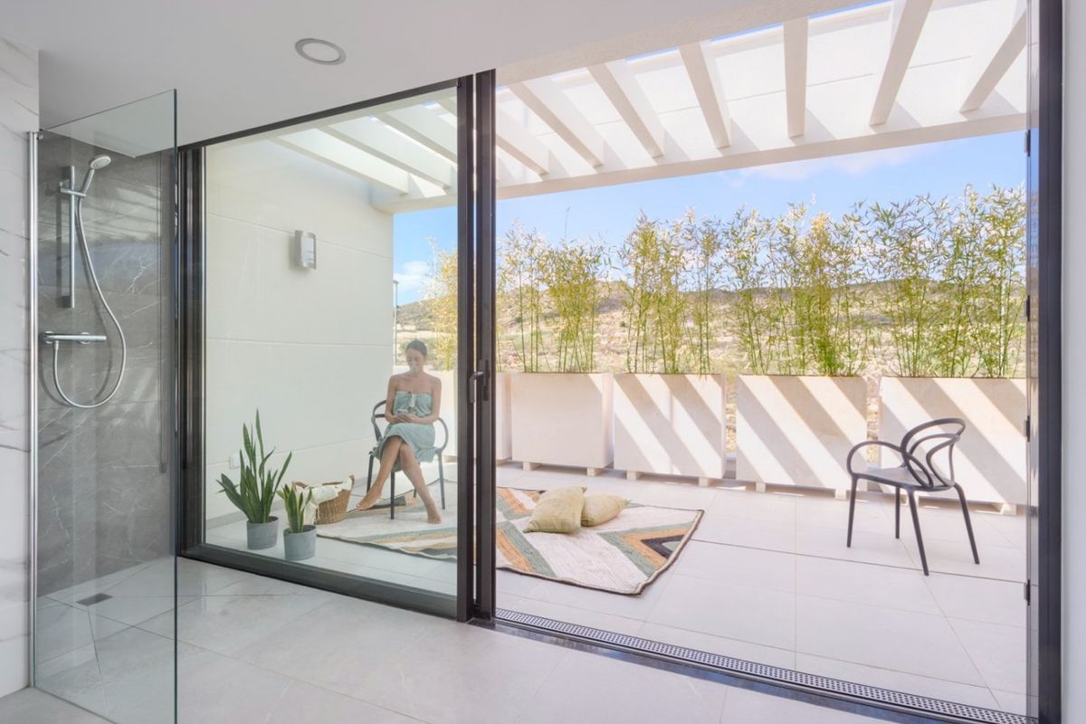 Modern bathroom with glass shower leading to a cozy terrace, Baños y Mendigo, 3-bed villa.