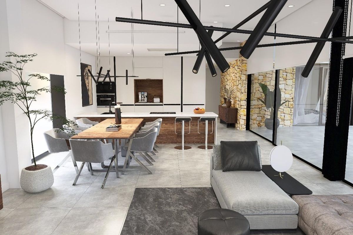 Stijlvolle binnenkant van de woonkamer en eetkamer met moderne inrichting in de open ruimte van de villa.