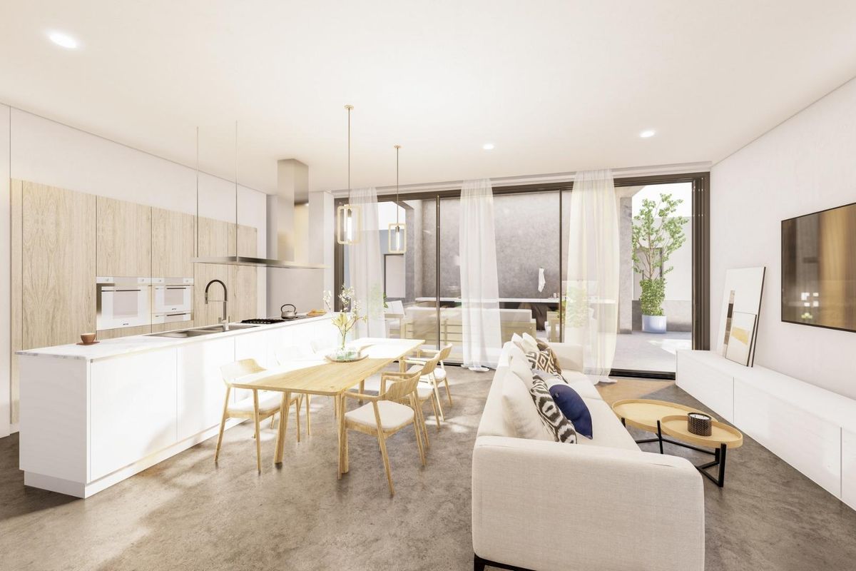 Open kitchen and dining area in a bright villa in Baños y Mendigo, Costa Calida, perfect for gatherings.