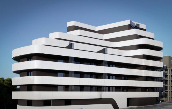 Modern appartementengebouw in Calpe met stijlvolle lijnen en een strak exterieurontwerp.