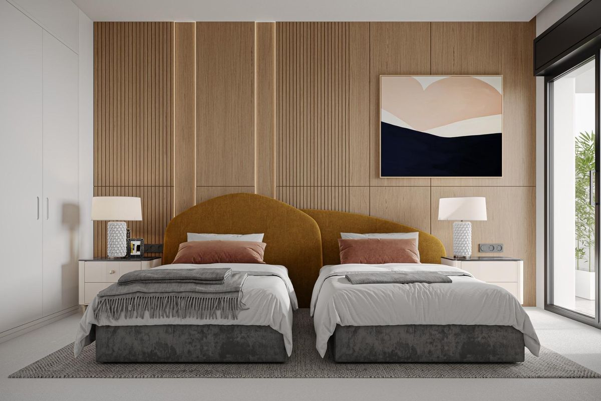 Stijlvol ingericht tweepersoonsbed met moderne details in een 3-slaapkamer appartement in Marbella.
