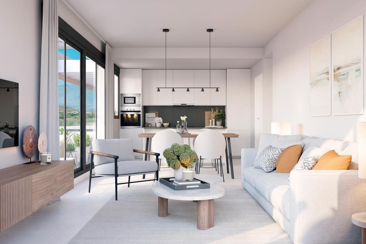 Stijlvol interieur van een woonkamer en keuken in een appartement op de begane grond in Casares, Costa del Sol.