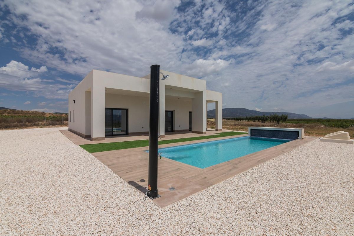 Side view of the villa showing the pool and outdoor space in Pinoso, Costa Blanca South.