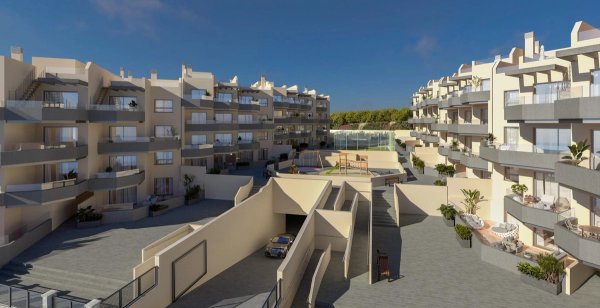 Buitenzicht op een modern 2-slaapkamer appartementcomplex in Torrox, Costa del Sol, met balkons en tuinen.