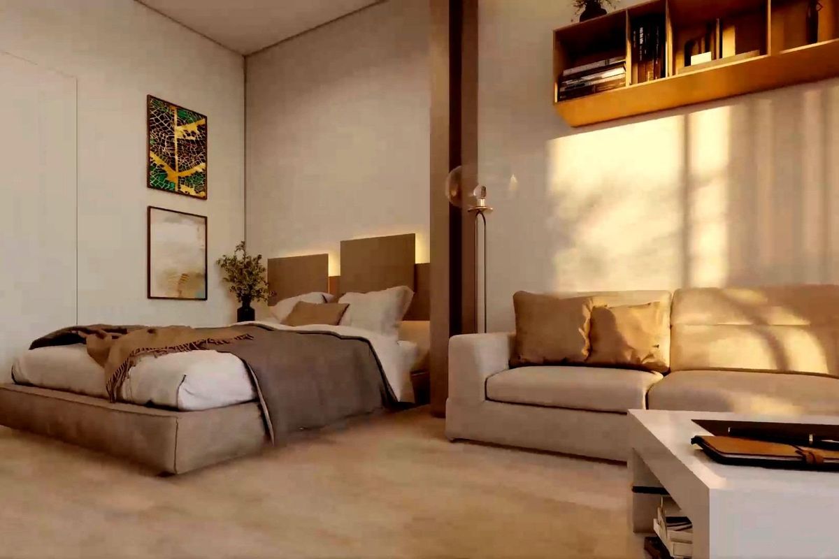 Gezellige slaapkamerhoek in een appartement in Torrevieja, met een bed en een bank in natuurlijk licht.