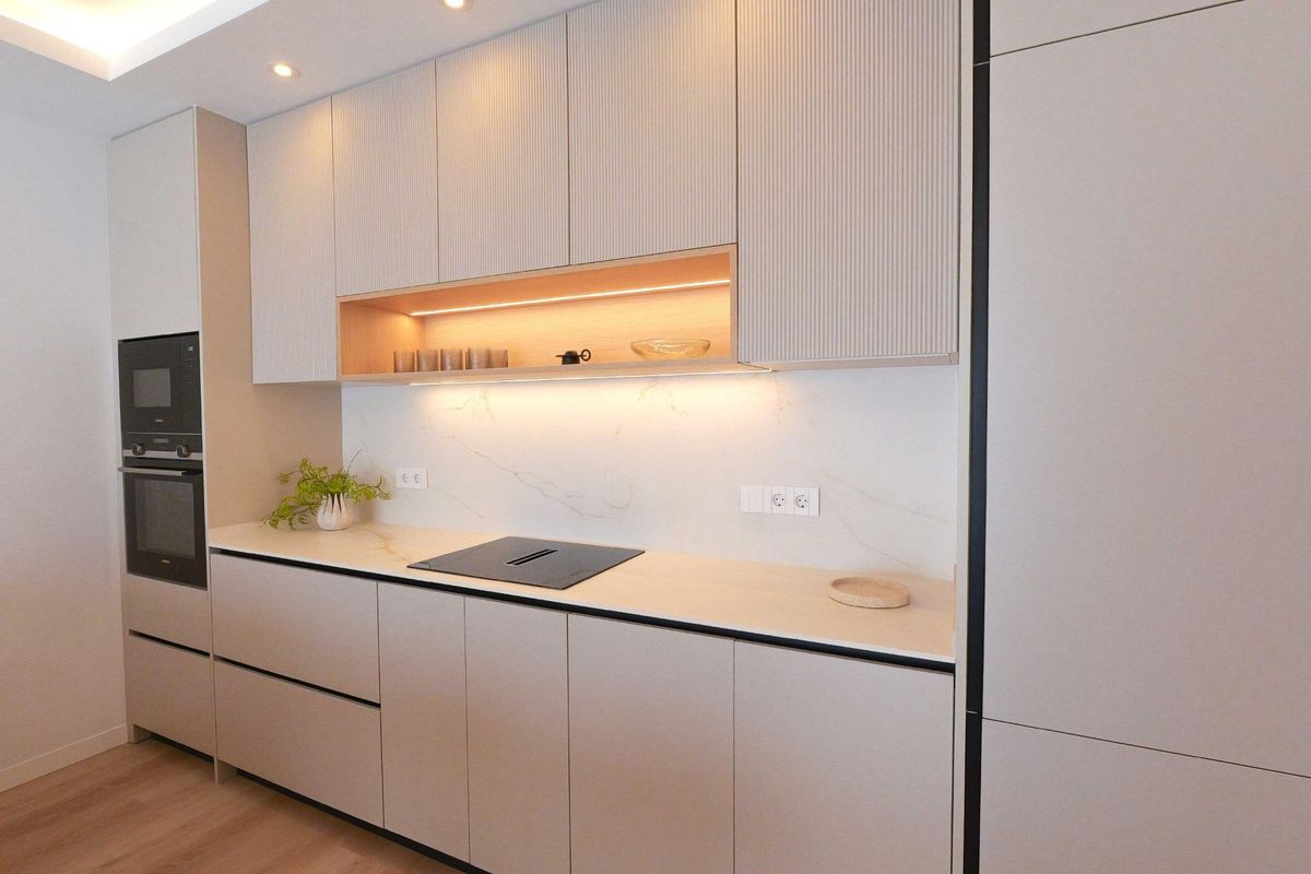 Sleek kitchen design featuring cabinetry and modern appliances in a 2-bed apartment, La Manga del Mar Menor.