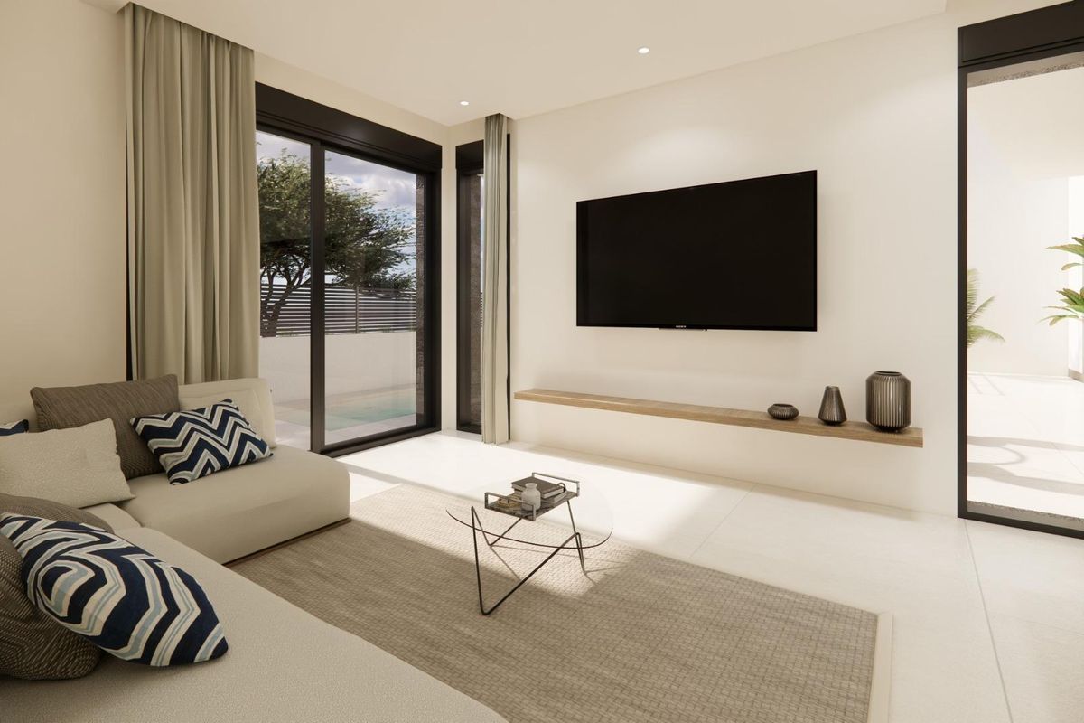 Heldere woonkamer van een stijlvolle bungalow in Dolores, met moderne meubels en grote ramen voor natuurlijk licht.