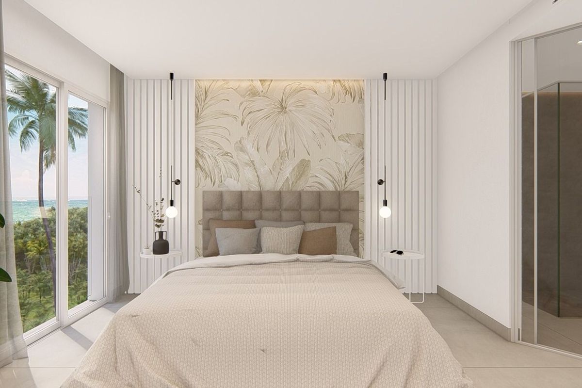 Elegant bedroom in a 3-bed apartment with a view of greenery, ideal for relaxation in Guardamar del Segura.