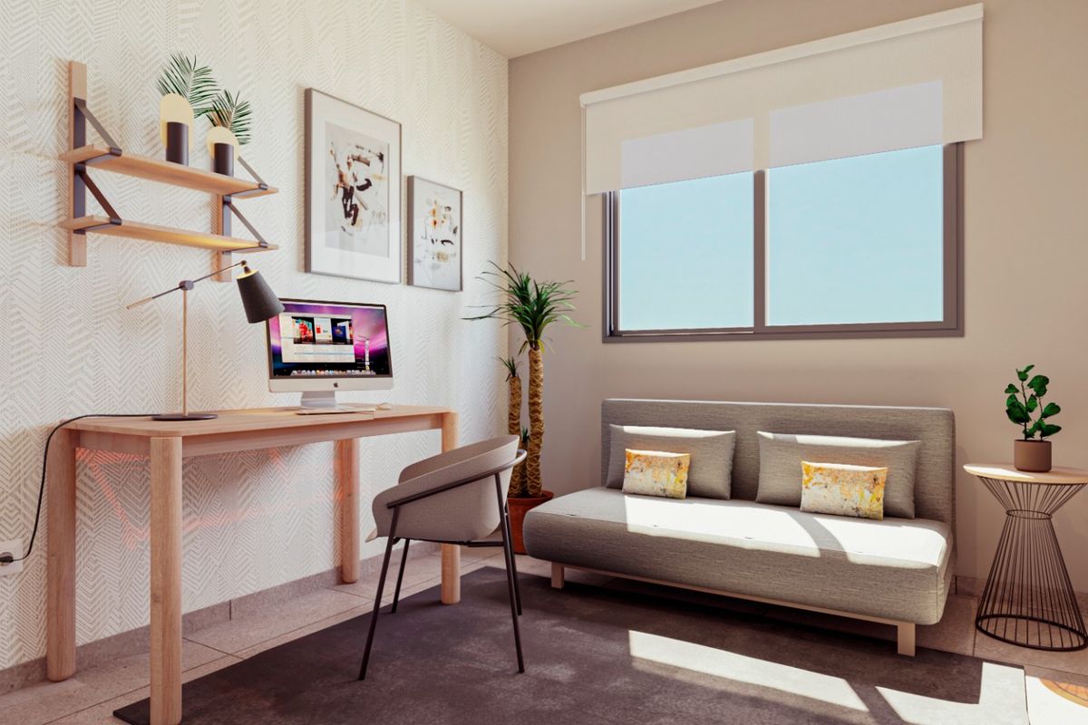 Heldere studiekamer in een modern appartement, met een bureau en een comfortabele zithoek in Punta Prima, Costa Blanca Zuid.