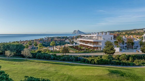 Stunning view of San Roque's coastline and nearby mountains from the exterior of a modern 3-bed apartment.