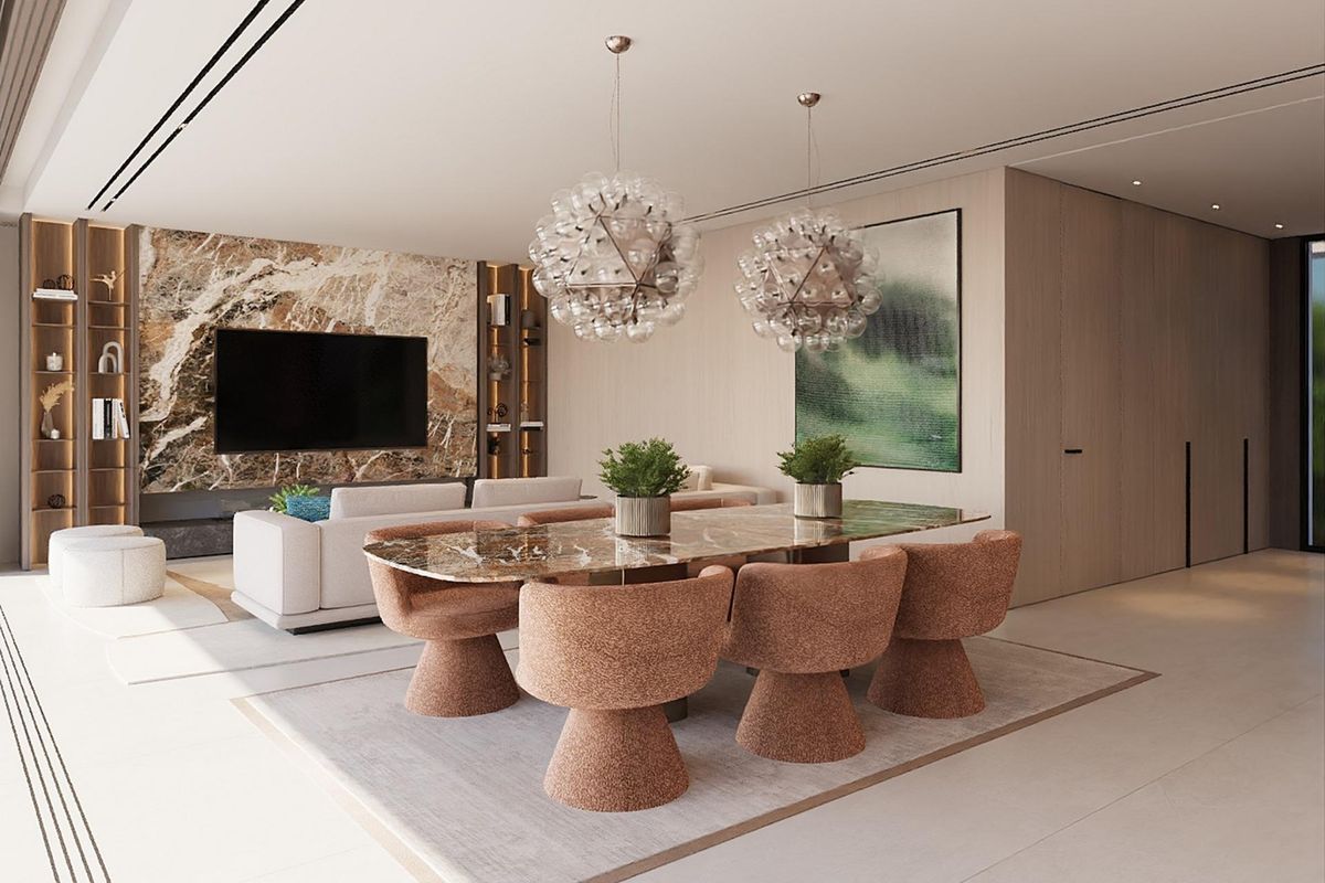 Elegante eetruimte met artistieke verlichting, perfect voor bijeenkomsten in deze woning in Ojen.