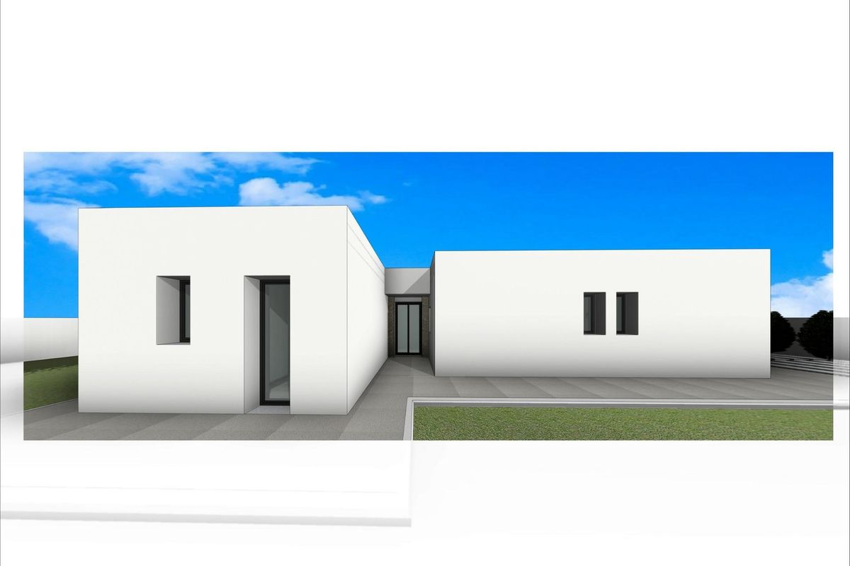 Facade van de villa in Aspe met een minimalistisch ontwerp, met strakke lijnen en een ruime entree.