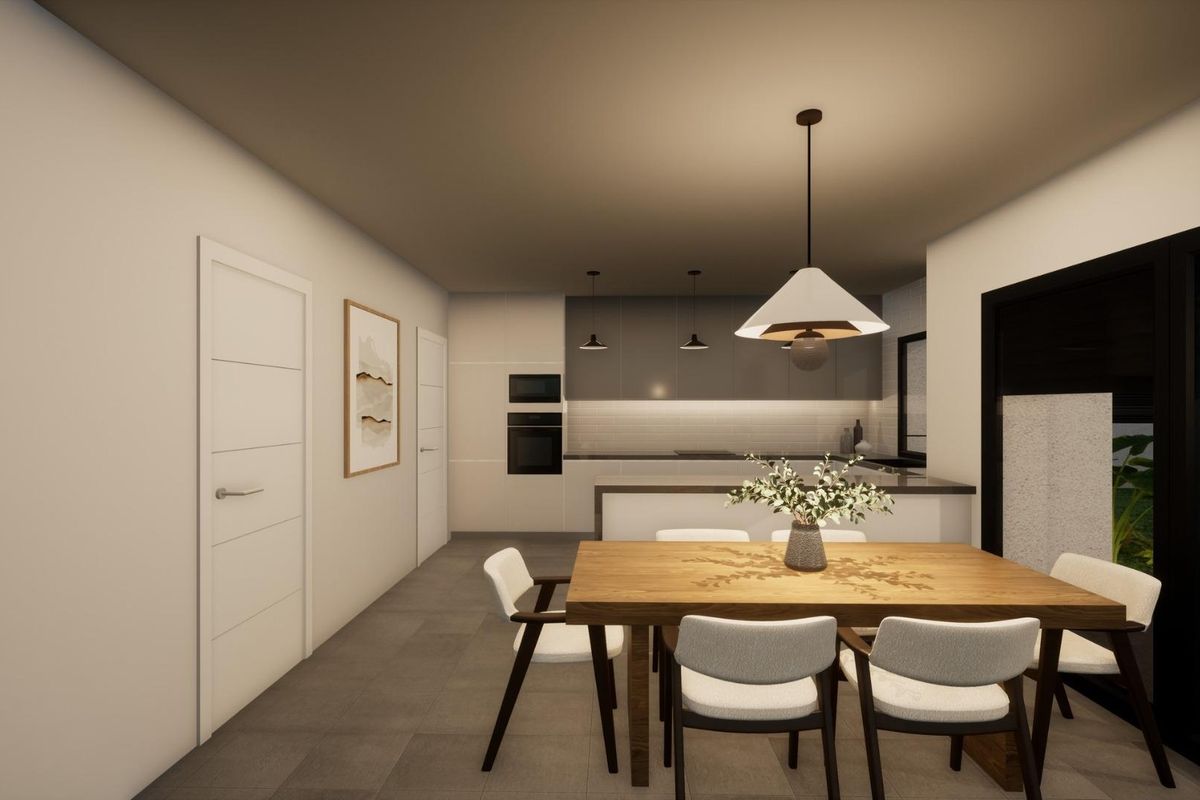 Dining area showcasing a stylish table in the Pinoso villa kitchen, with light pouring through the windows.
