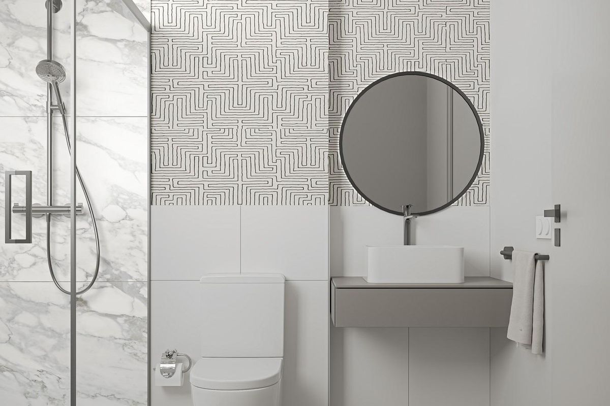 Stijlvolle gastenbadkamer met geometrische tegels en chique esthetiek in een appartement in Marbella.