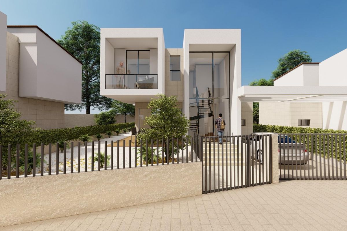 Moderne 3-slaapkamer villa exterieur in La Nucia, Costa Blanca, omgeven door groen en een hekje.