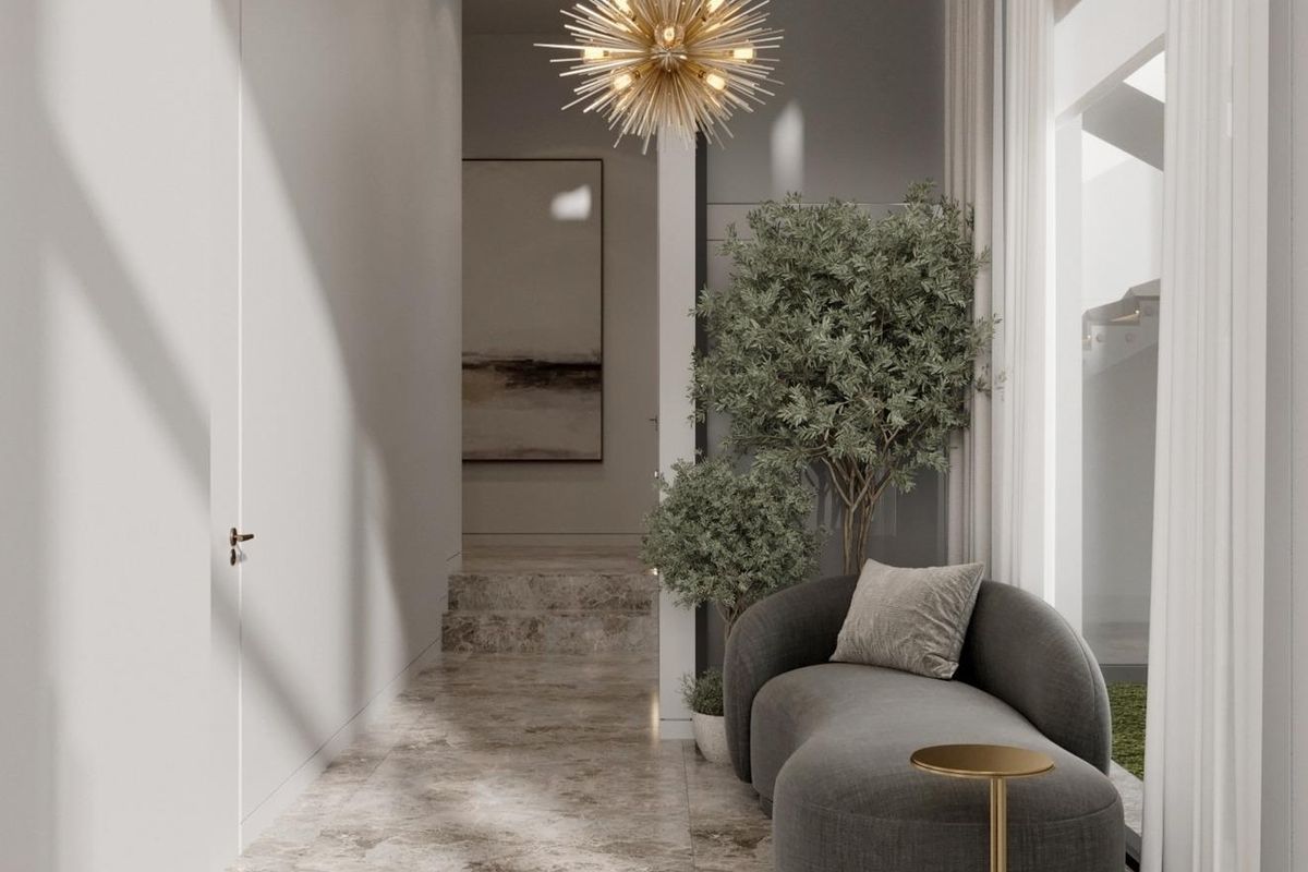 Elegante gang met moderne verlichting en zithoek in een 6-slaapkamer villa in Marbella, Costa del Sol.