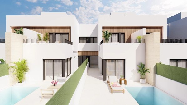 Buitenkant van een modern 3-slaapkamer townhousecomplex in Santiago de la Ribera, met een gedeeld zwembad.