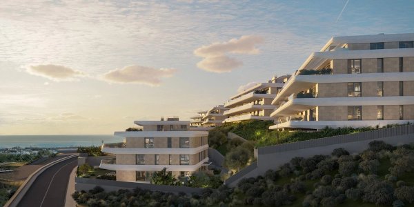 Eigentijds appartementencomplex in Estepona, Costa del Sol, met groene tuinen en zeezicht.