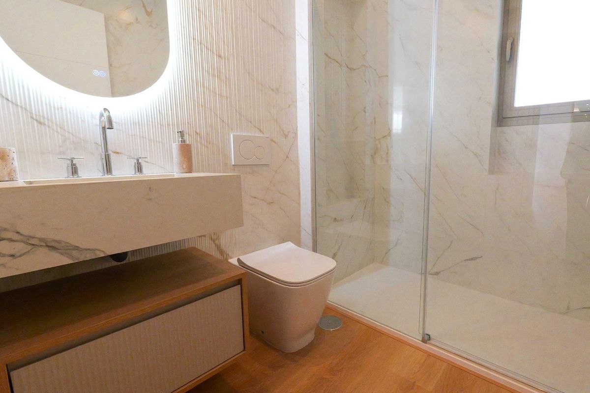 Elegant bathroom showcasing marble design and modern amenities in a 2-bed apartment, La Manga del Mar Menor.